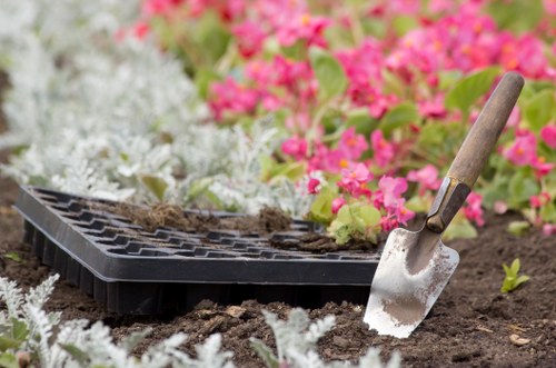Soil and level checks during a garden drainage project in Feltham